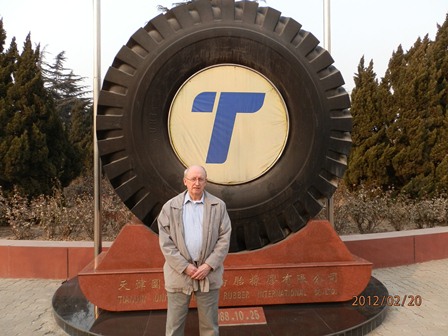 Mike standing in front of a tire in Tinajin, China. Either Mike has shrunk quite a bit or that's a very, very big tire!