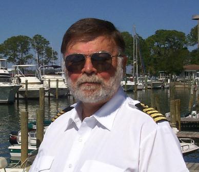 Bill in his Captian's uniform. He holds a USCG Captian's License with a 100-ton Master on Near Coastal waters (up to 200 nautical miles offshore) with a Sailing Endorsement.